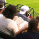 Illustration for article titled Yet Another Photo Of Someone Reading At A Baseball Game